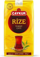 Caykur Rize Black Tea 500 g in yellow packaging featuring a traditional Turkish tea glass with dark black tea. Iconic Turkish tea from the Rize region.