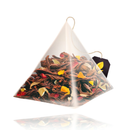 Close-up of Curtis Hawaii Sunkiss Black Tea pyramid bag showing vibrant tea leaves and fruit pieces, perfect for premium tea infusion.