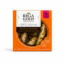 Riga Gold Delicatesse Brisling Sardines in olive oil with gourmet spices, in an orange box with a clear window showing the prepared sardines inside.