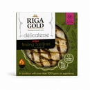 Riga Gold Grilled Brisling Sardines in olive oil, presented in its retail packaging. The box is olive green with a clear circular window showing the cooked sardines inside, featuring the brand logo 'RIGA GOLD' and a pink 'Gourmet Selection' badge.