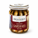 A glass jar of Riga Gold Smoked Sardines in Oil, featuring gold foil-wrapped sardines inside, a white and gold lid, and a maroon and white label.