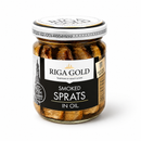 A glass jar of Riga Gold Smoked Sprats in Oil, featuring a black and white label with gold accents and a white lid, set against a plain white background.